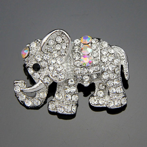 Silver elephant brooch with rhinestones on a gray background