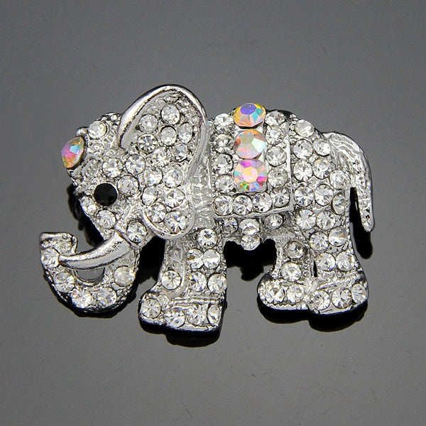 Silver elephant brooch with rhinestones on a gray background