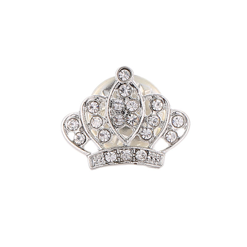 Silver crown-shaped brooch with clear gemstones on a white background