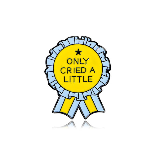 Badge with 'Only Cried a Little' text on a white background