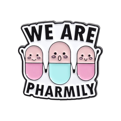 Enamel pin with three cartoon-style pills and text 'WE ARE PHARMILY' on a white background