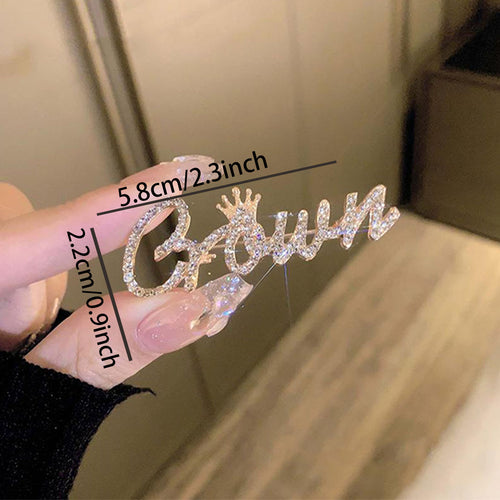 Crystal 'Crown' hair accessory held by a hand with measurements displayed.