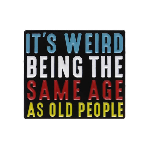 Colorful text sign saying 'It's weird being the same age as old people' on a black background