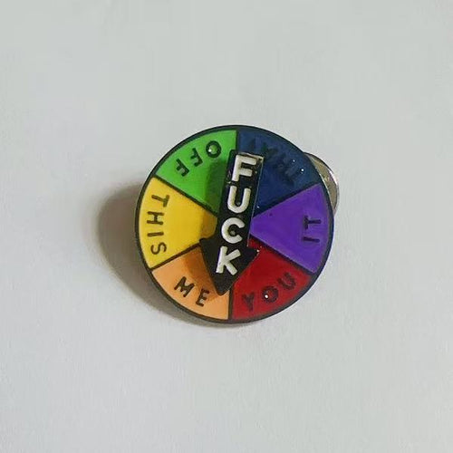 Multicolored wheel with text FUCK, IT, YOU, ME, THIS, OFF, THAT WHEEL  on a white background