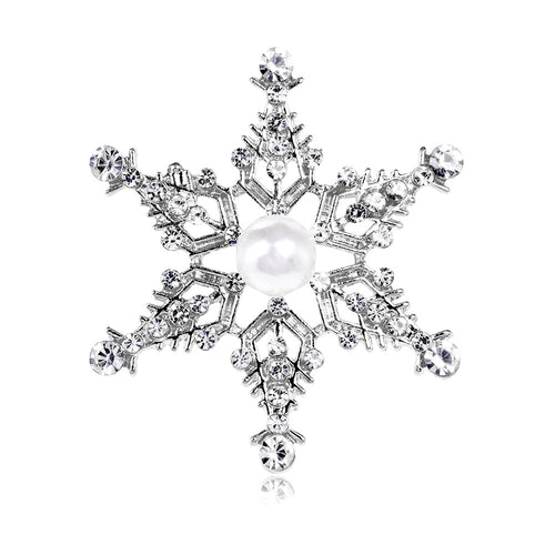 Decorative snowflake with pearls and crystals on a white background