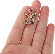 Load image into Gallery viewer, Gold and crystal decorative item held between fingers on a white background