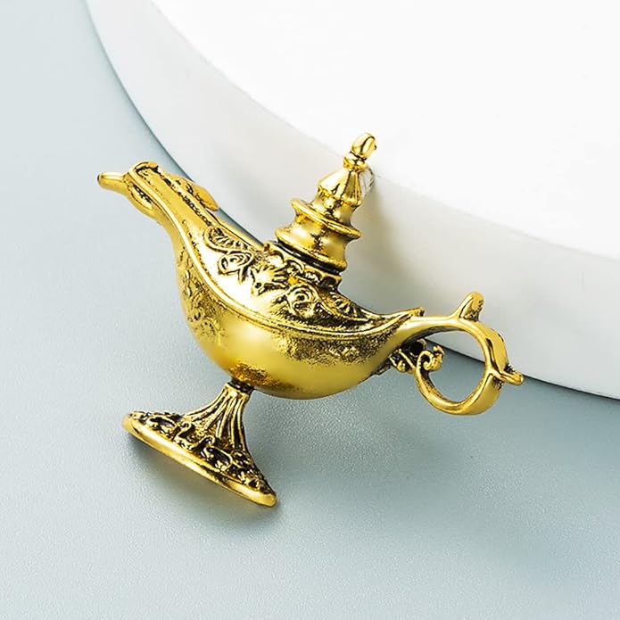 Gold genie lamp on a light blue background