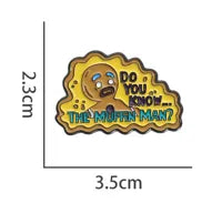 Load image into Gallery viewer, Metallic badge with cartoon character and text &#39;Do you know... The Muffin Man?&#39; on a white background.