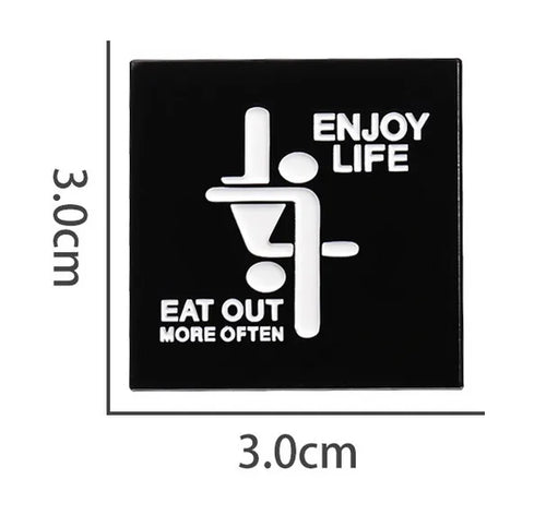 Black PIN with white text ENJOY LIFE EAT OUT MORE OFTEN and design, dimensions indicated.
