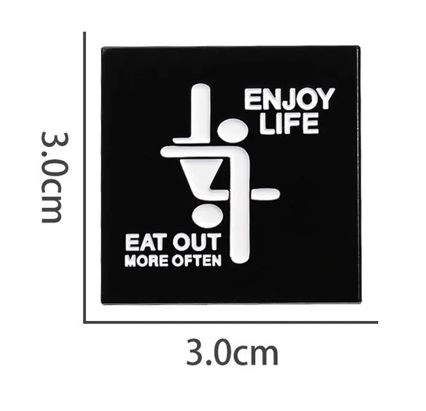Black PIN with white text ENJOY LIFE EAT OUT MORE OFTEN and design, dimensions indicated.