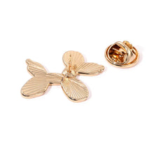 Load image into Gallery viewer, Gold butterfly-shaped brooch on a white background