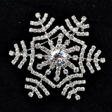 Load image into Gallery viewer, Decorative snowflake brooch with rhinestones on a black background