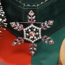 Load image into Gallery viewer, Decorative brooch with pink and clear gemstones on a green and red background