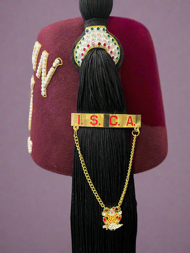 Black tassel with 'I.S.C.A.' on a maroon background