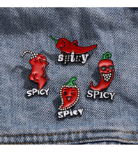 Load image into Gallery viewer, Set of spicy-themed pins on a denim background