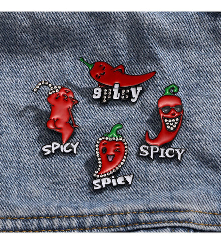 Set of spicy-themed pins on a denim background