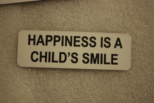 HAPPINESS IS A CHILDS SMILE