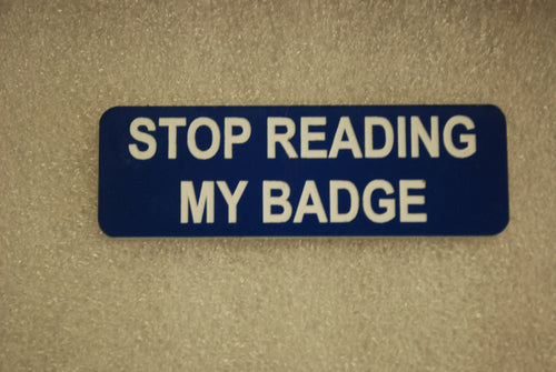 STOP READING MY BADGE