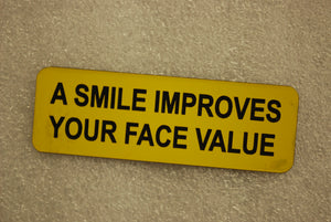 A SMILE IMPROVES YOUR FACE VALUE