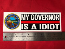 Load image into Gallery viewer, MY GOVERNOR IS A IDIOT MINNESOTA BUMPER STICKER  3&quot; X 9&quot;  Our Decals Are Die Cut from Premium Exterior Vinyl (no background) while others are Digitally Printed with UV resistant inks on White Adhesive Vinyl. All of our Vinyl Decals are Car Wash Safe and will not fade or peel.Also very popular on Bedroom Wall, Mirrors,Automobile Windows, Boats or any smooth surface. 3.5- 6.0 Mill’s thick.   FREE SHIPPING 