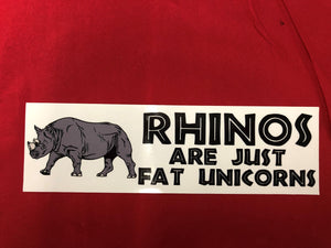 RHINOS ARE JUST FAT UNICORNS  BUMPER STICKER  3" X 9"     Our Decals Are Die Cut from Premium Exterior Vinyl (no background) while others are Digitally Printed with UV resistant inks on White Adhesive Vinyl. All of our Vinyl Decals are Car Wash Safe and will not fade or peel.Also very popular on Bedroom Wall, Mirrors,Automobile Windows, Boats or any smooth surface. 3.5- 6.0 Mill’s thick.   FREE SHIPPING 